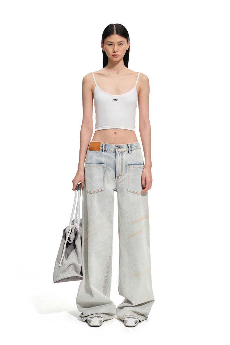 NAWS INTERPRETATION butterfly layering camisole — product detail view showing texture and hardware