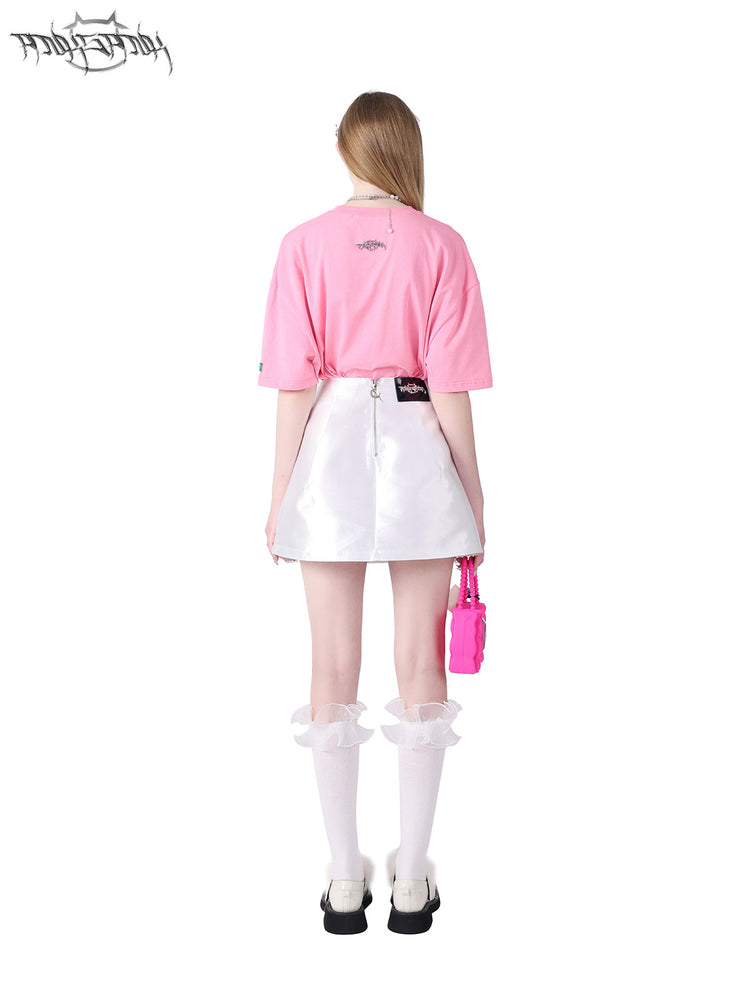PINKSPINK GARFIELD oversized graphic tee — pink back modeled view with the tee tucked into a white skirt