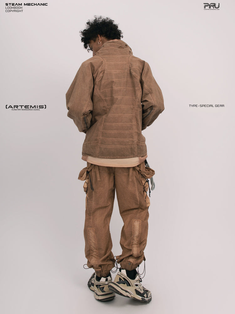 ARTEMIS soft dawn orange tuck-paneled technical jacket — rear three-quarter modeled view showing tuck panels