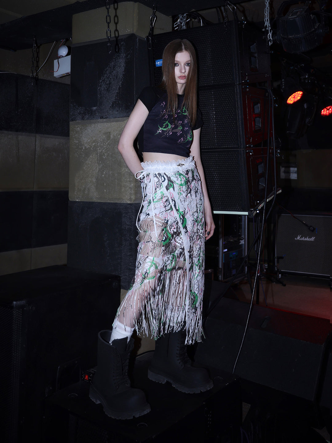 PINKSPINK ELECTRIC MOON fitted mesh crop tee — side modeled view styled with a white layered skirt