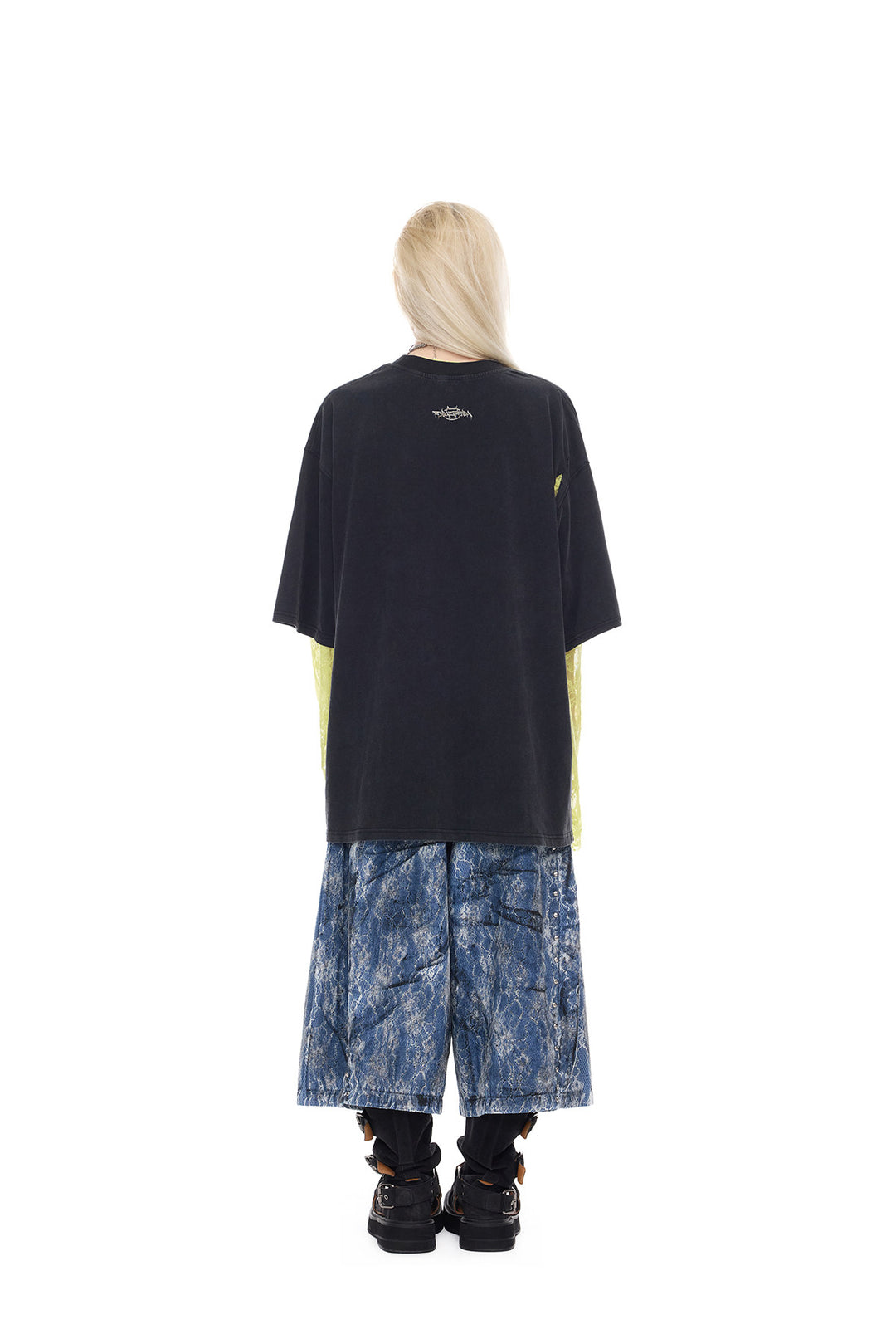 PINKSPINK ELECTRIC MOON lace-coated wide-leg denim shorts in blue — full-length back modeled view with a washed black tee and yellow lace sleeves