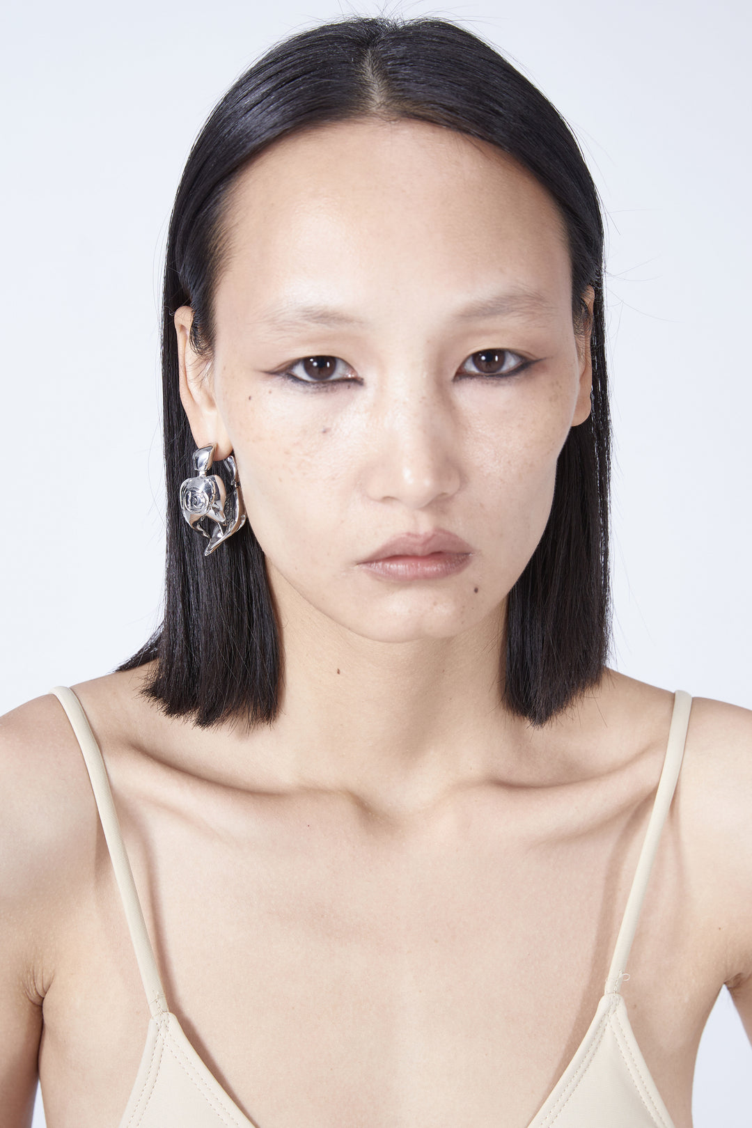 EMBRYO VENOM CLAW sculptural earrings — full-length modeled view