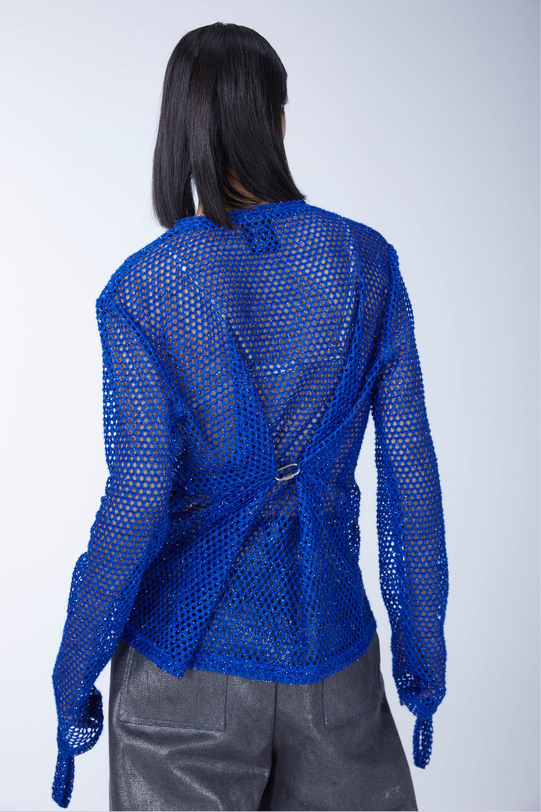EMBRYO BLUE VOID cutout mesh finger-sleeve top — close modeled styling view