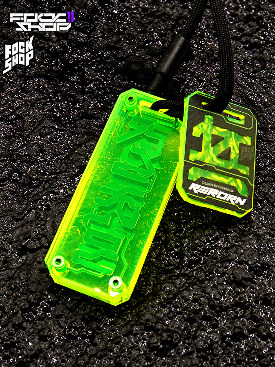 FOCKSHOP REBORN talisman charm — FLUORESCENT GREEN CLEAR close-up showing the transparent backing