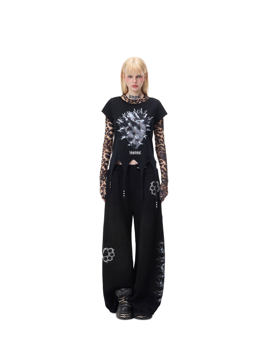 PINKSPINK PUNK CACTUS studded pointed-hem tee in black — centered full-length front modeled view over a separate leopard mesh layer, also shown in the hero collage