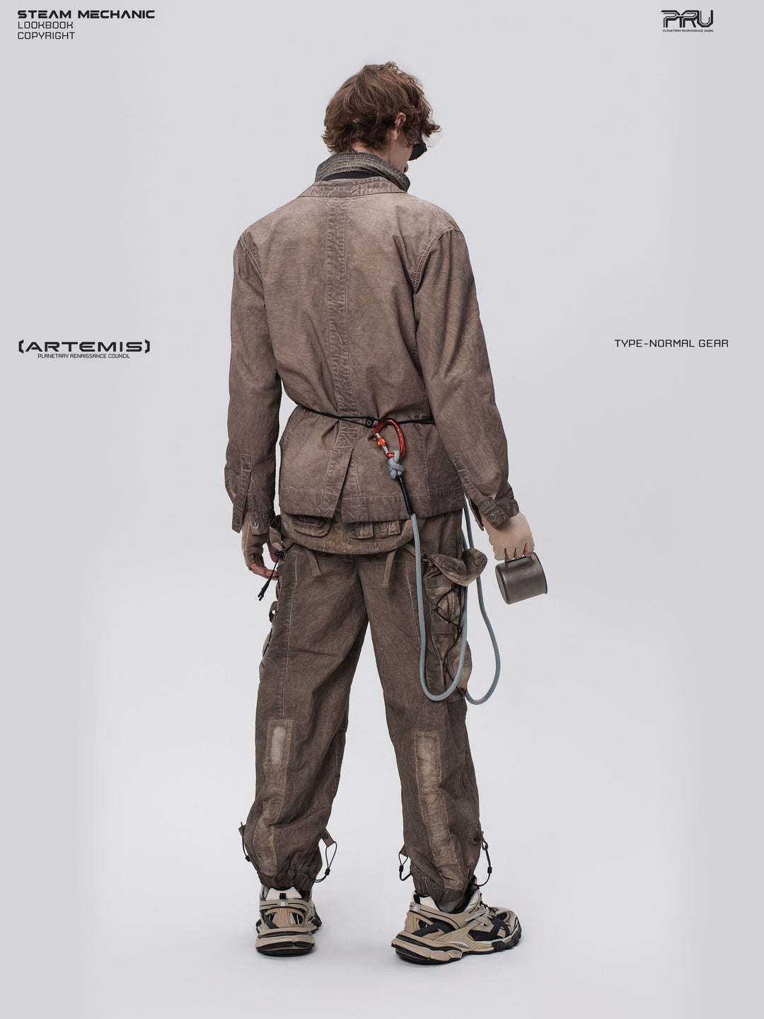 GAIA ochre brown open-collar technical robe — full-length back view looking over the shoulder