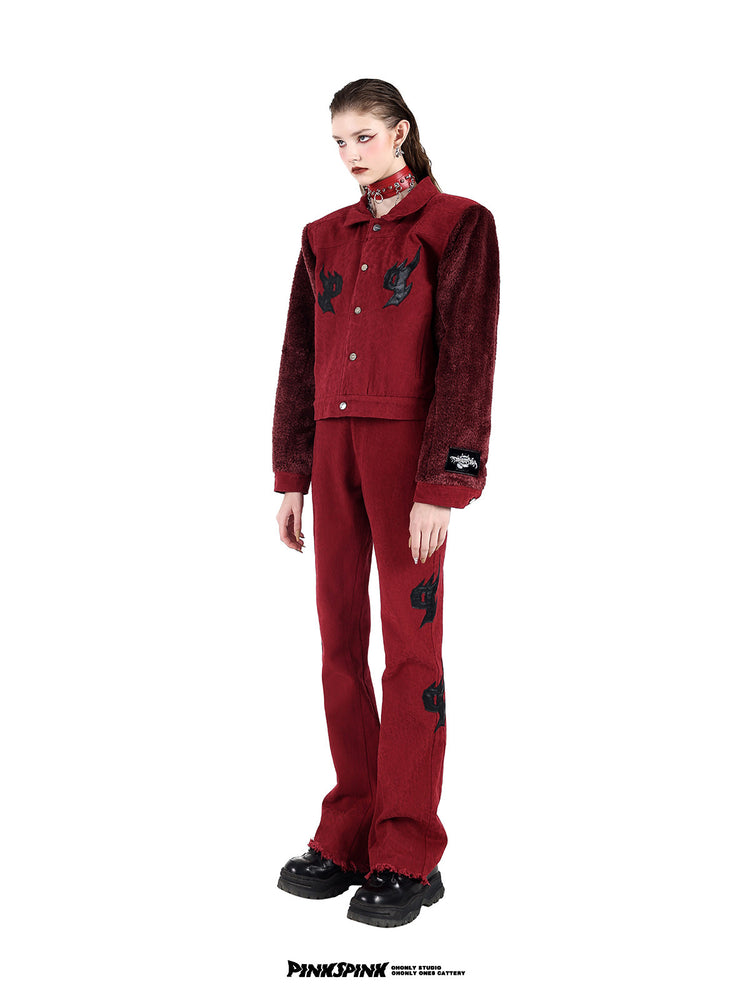 PINKSPINK SPIKE RING studded chain choker in red — three-quarter full-length modeled view with a red jacket and matching trousers