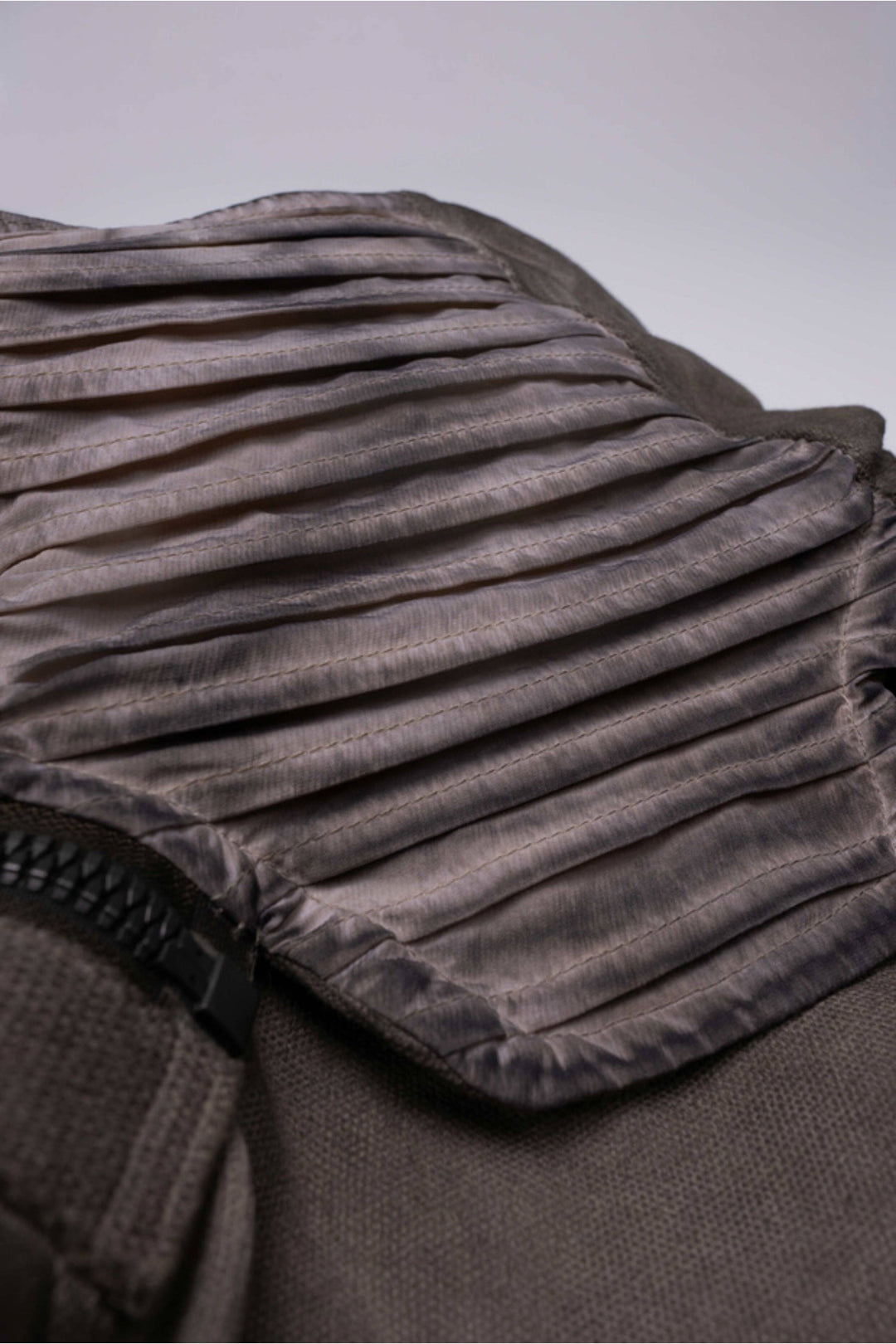 FISSION modular vest in mercury brown — close-up of the pleated detachable collar