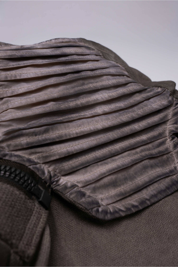 FISSION modular vest in mercury brown — close-up of the pleated detachable collar