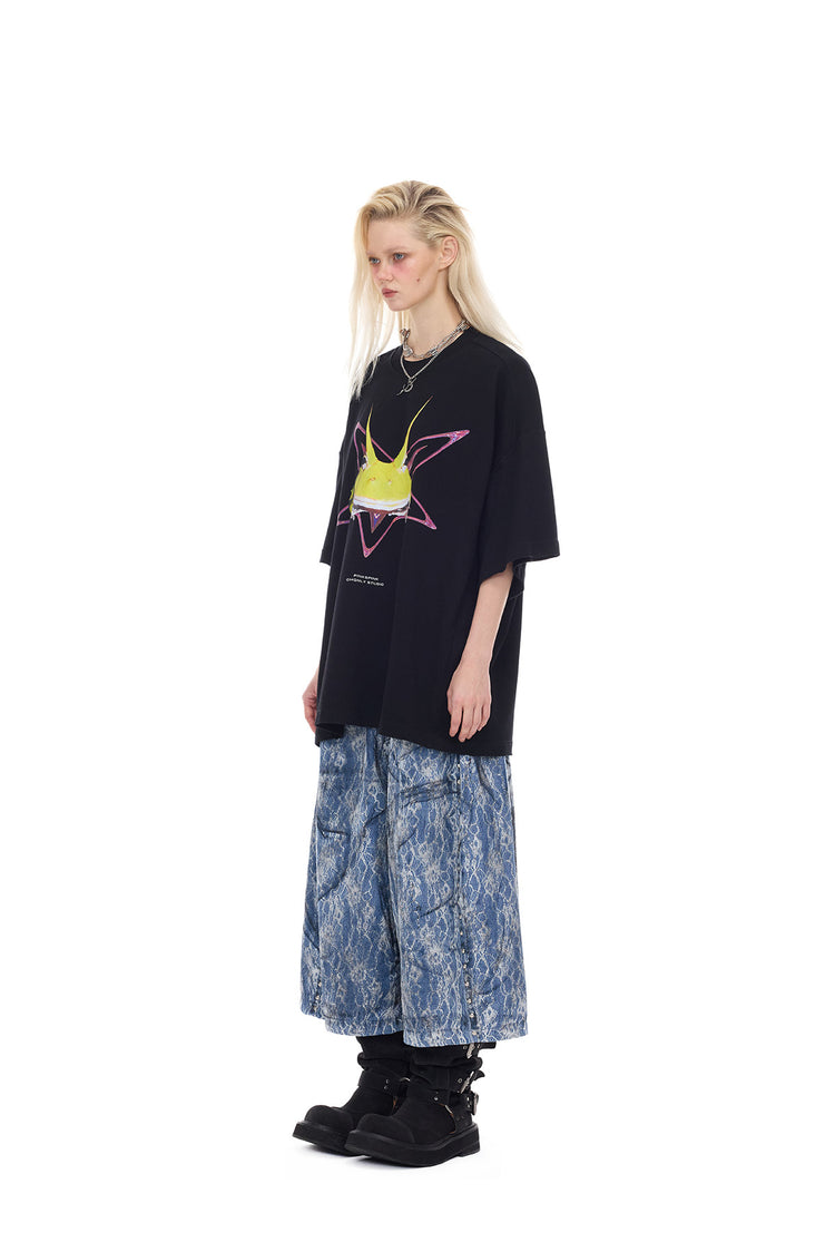PINKSPINK ELECTRIC MOON lace-coated wide-leg denim shorts in blue — full-length angled modeled view with a pink-accent graphic tee