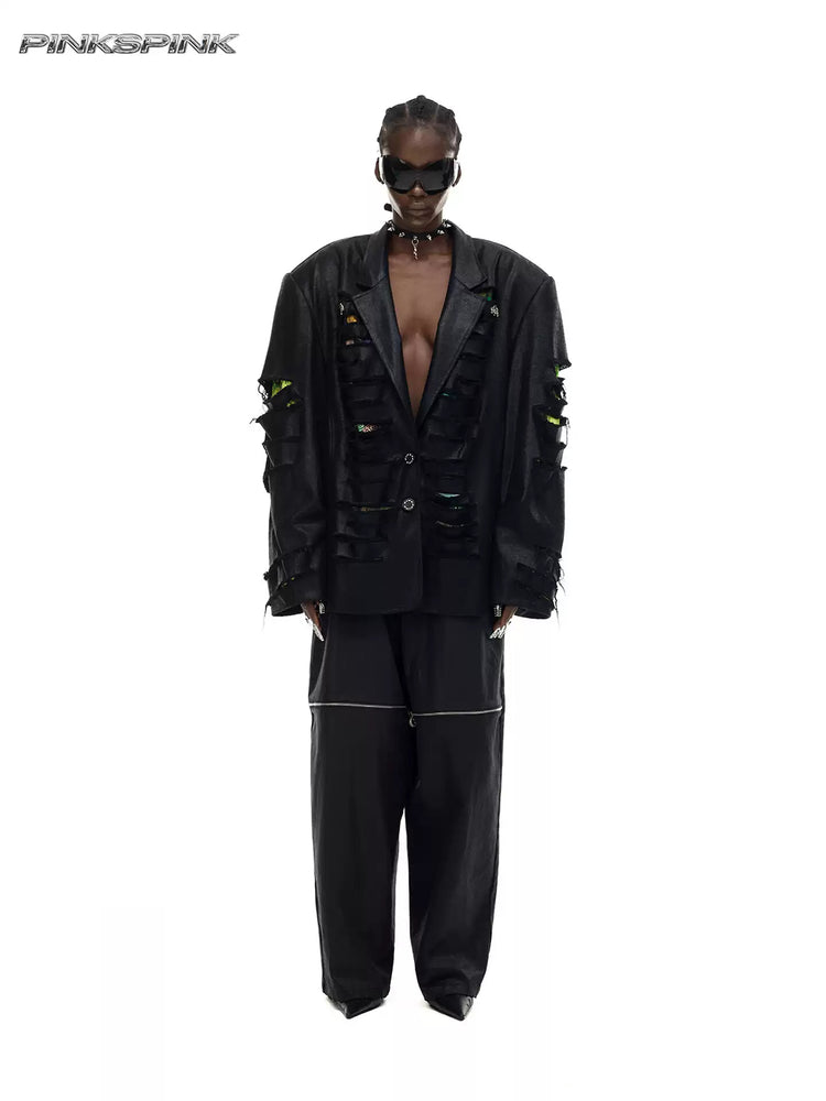 PINKSPINK ELECTRIC MOON coated zip-knee wide-leg pants in black — front full-length modeled view styled with a distressed blazer