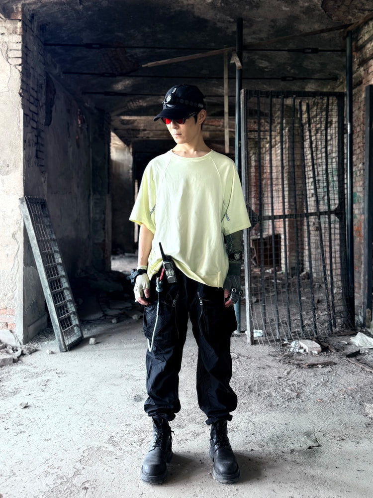 ERODED SPINE distressed asymmetric tee — material and silhouette detail