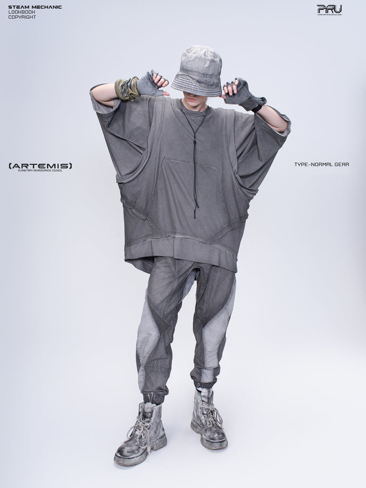 AEGIS cropped moto riding pants — lunar gray full-length modeled view with raised arms and the articulated knees visible
