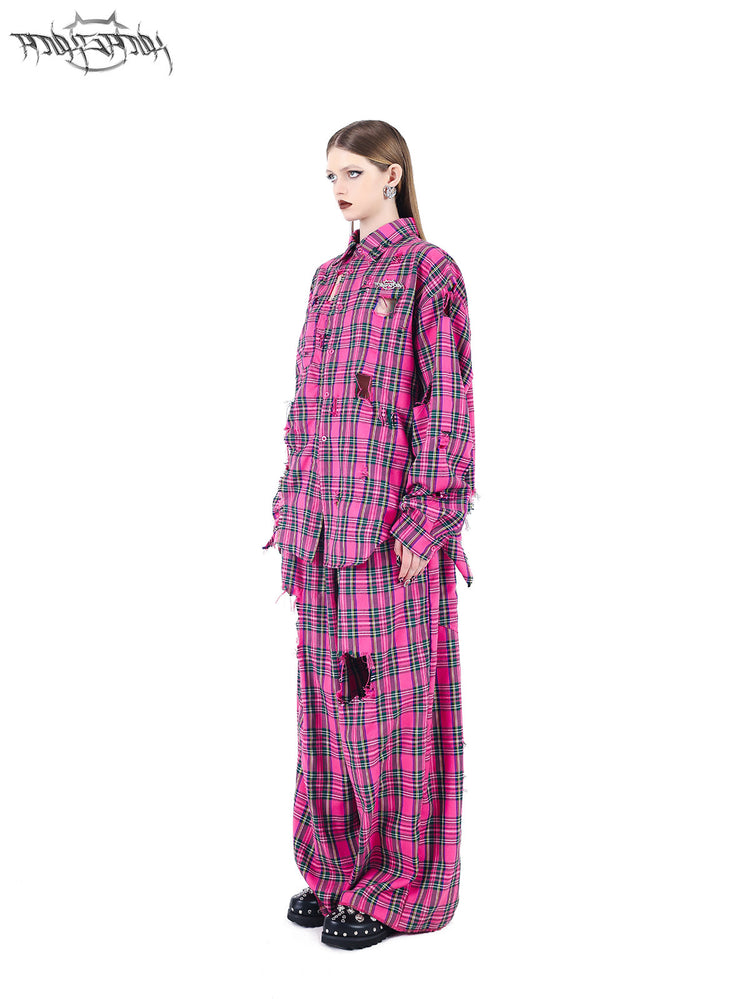 PINKSPINK PINK RIOT distressed plaid wide-leg pants — pink plaid side modeled view with coordinating shirt