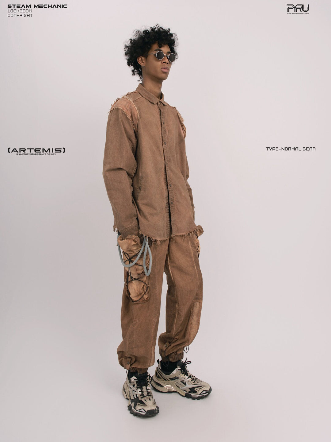 CHAOS ERA raw-edge technical shirt in soft dawn orange — full-length side-front modeled view showing the raw-edge shoulder and curved hem