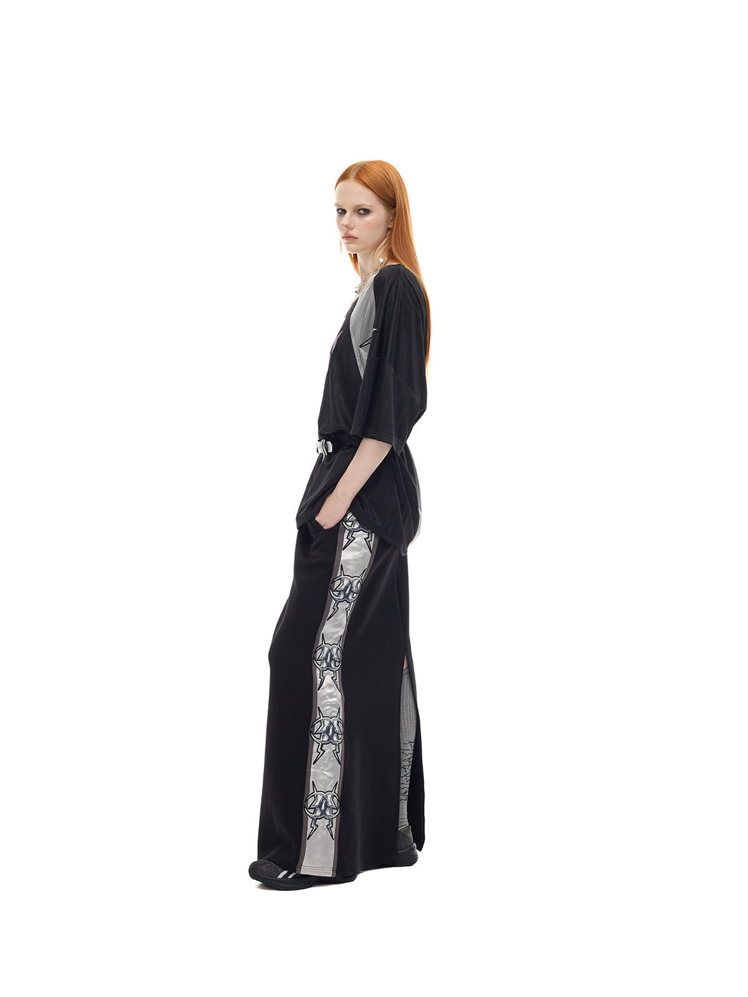 PINKSPINK FLAMECAT oversized sports jersey in black and gray — full-length side view showing the wide short sleeves