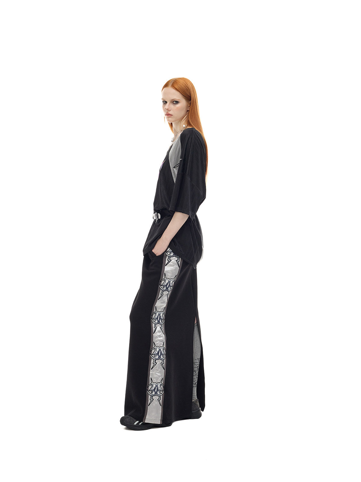 PINKSPINK FLAMECAT oversized sports jersey in black and gray — full-length side view showing the wide short sleeves