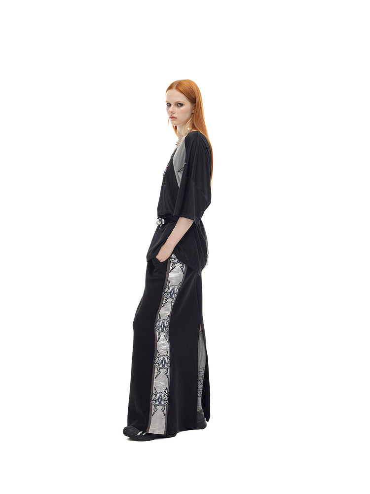 PINKSPINK FLAMECAT oversized sports jersey in black and gray — full-length side view showing the wide short sleeves