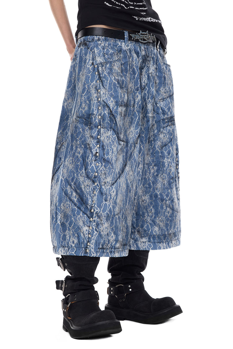 PINKSPINK ELECTRIC MOON lace-coated wide-leg denim shorts in blue — close angled front view showing the wide leg and stud placement