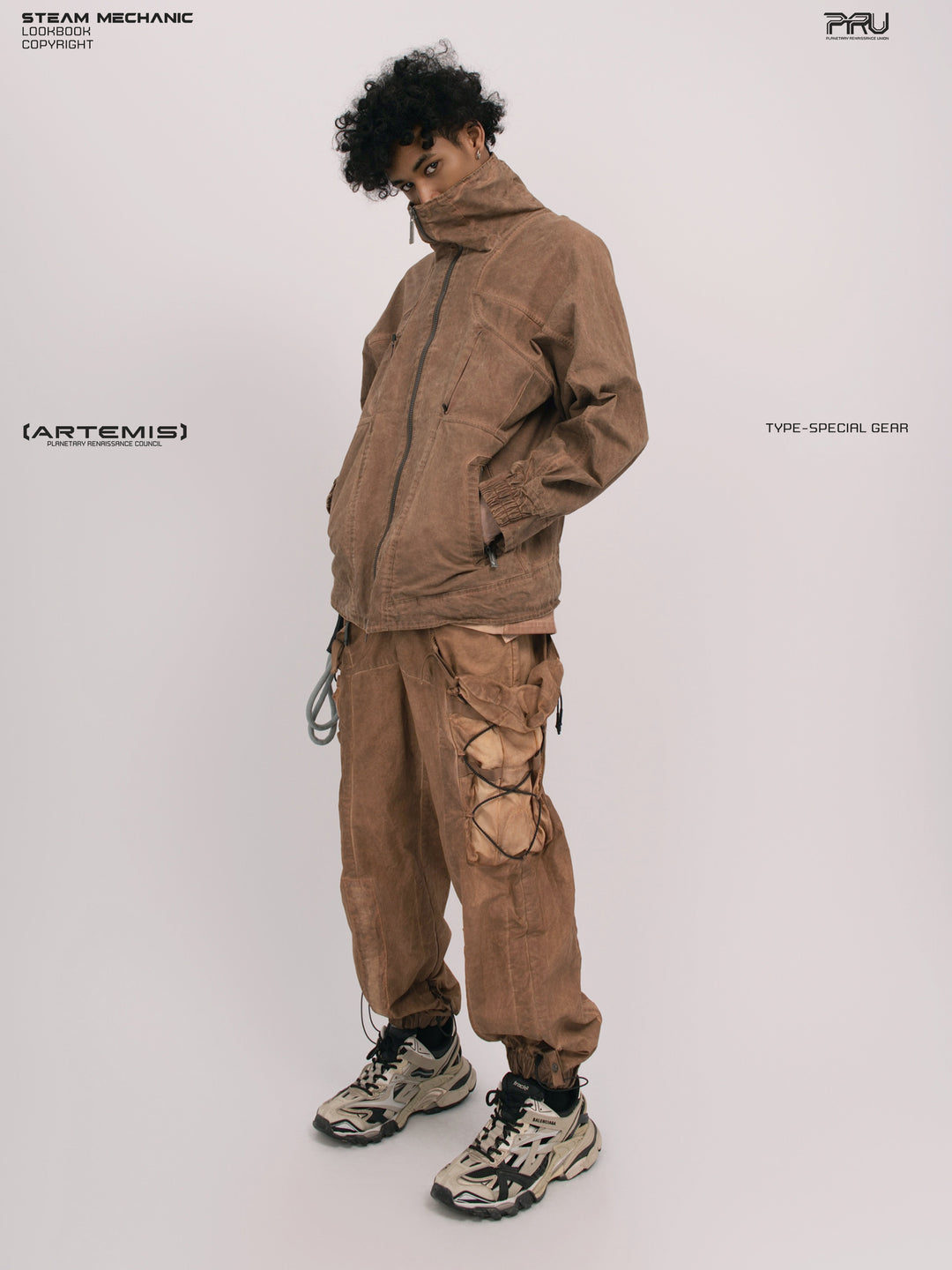 ARTEMIS soft dawn orange tuck-paneled technical jacket — full-length three-quarter modeled view with a hand in the pocket