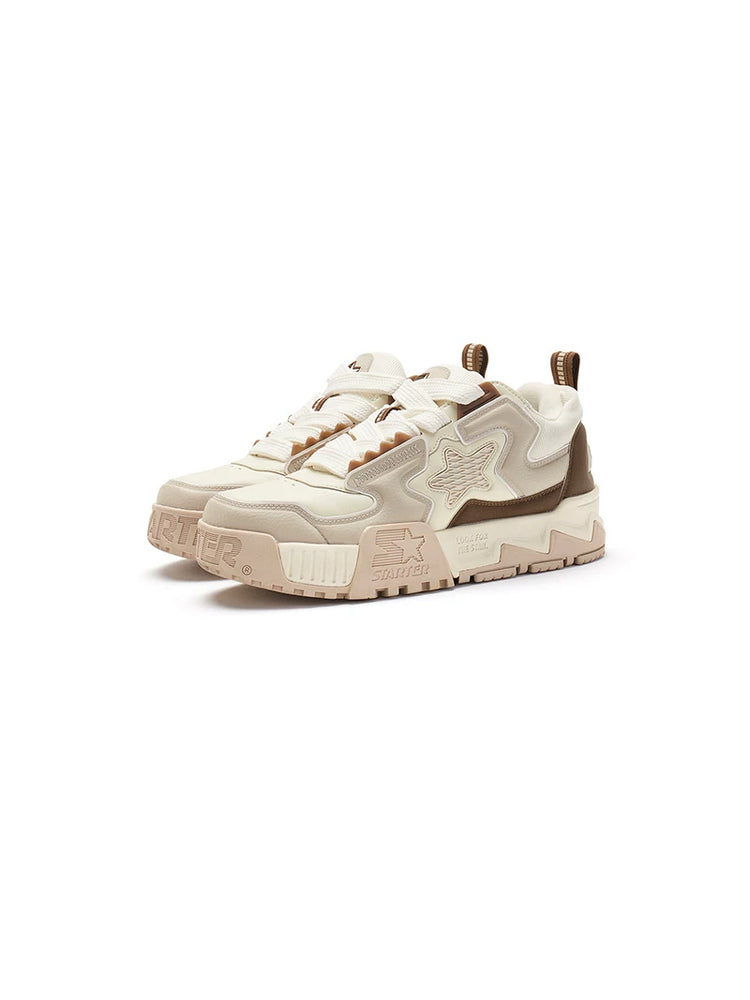 STARTER PUFF Croissant Brown pair in a clean three-quarter studio view, showing padded star panels, broad laces and sculpted platforms