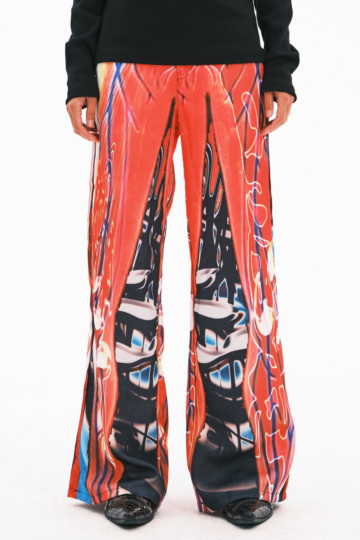 EMBRYO NEURAL FIRE printed flare pants — full-length modeled view