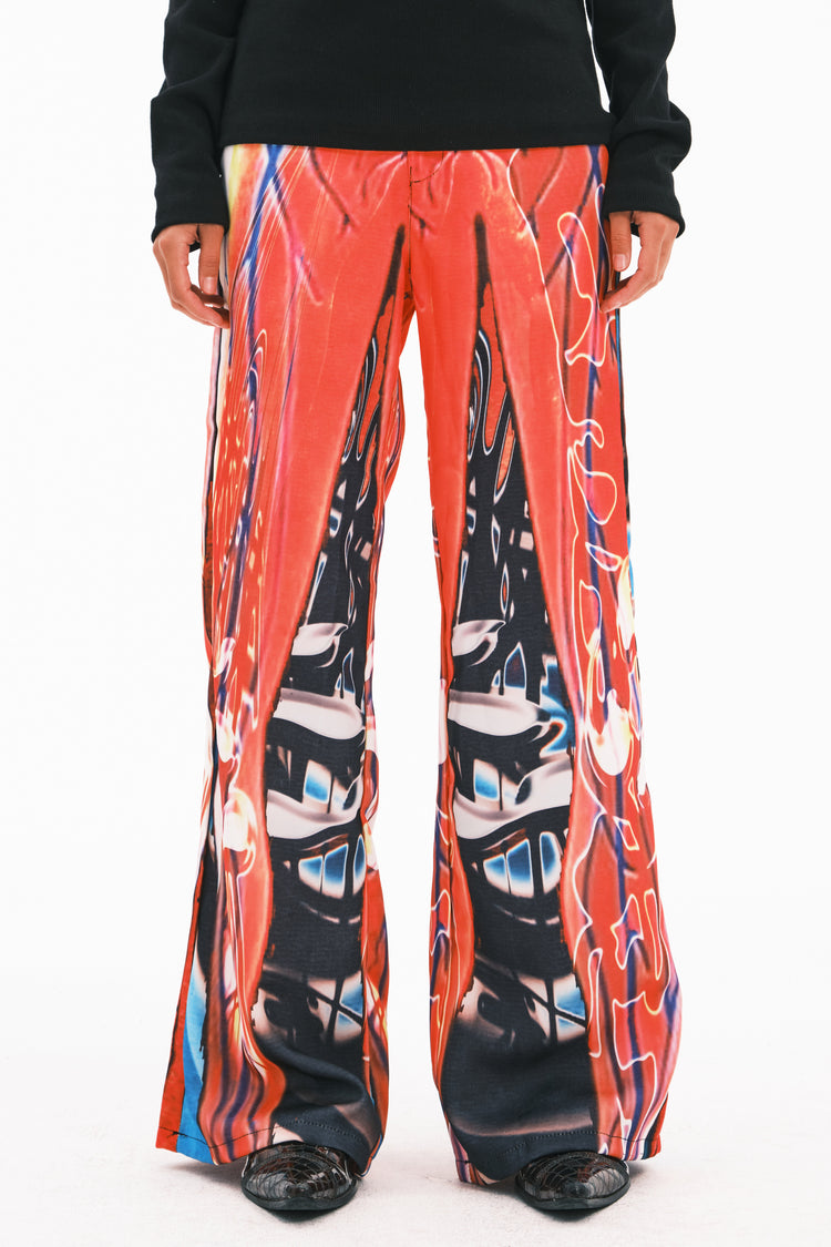 EMBRYO NEURAL FIRE printed flare pants — full-length modeled view