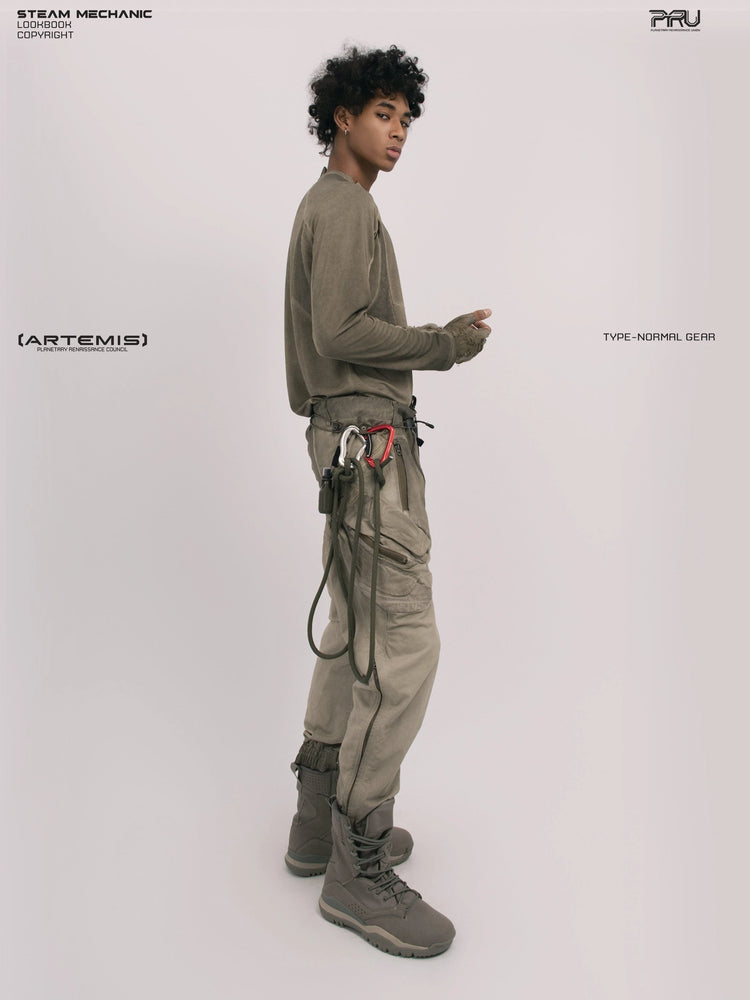 TWIN STAR lunar soil teal stretch riding base-layer top — full-length side view looking over the shoulder
