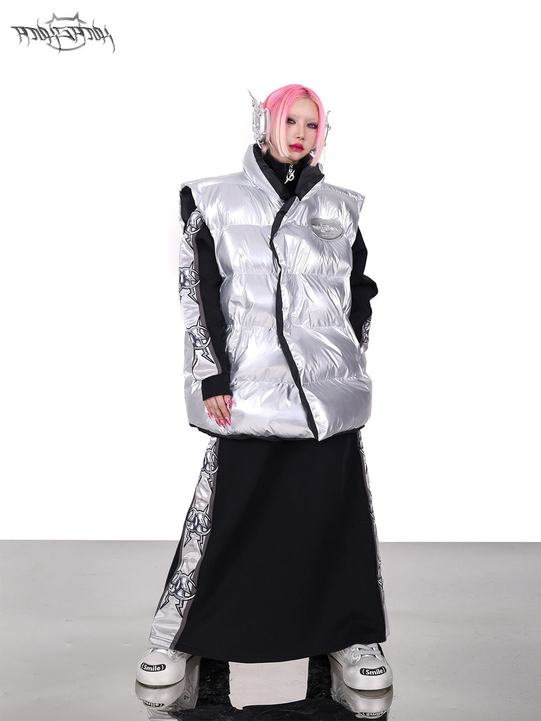 PINKSPINK ORBIT reversible padded vest in black silver — silver-side front full-length modeled view with the collar raised