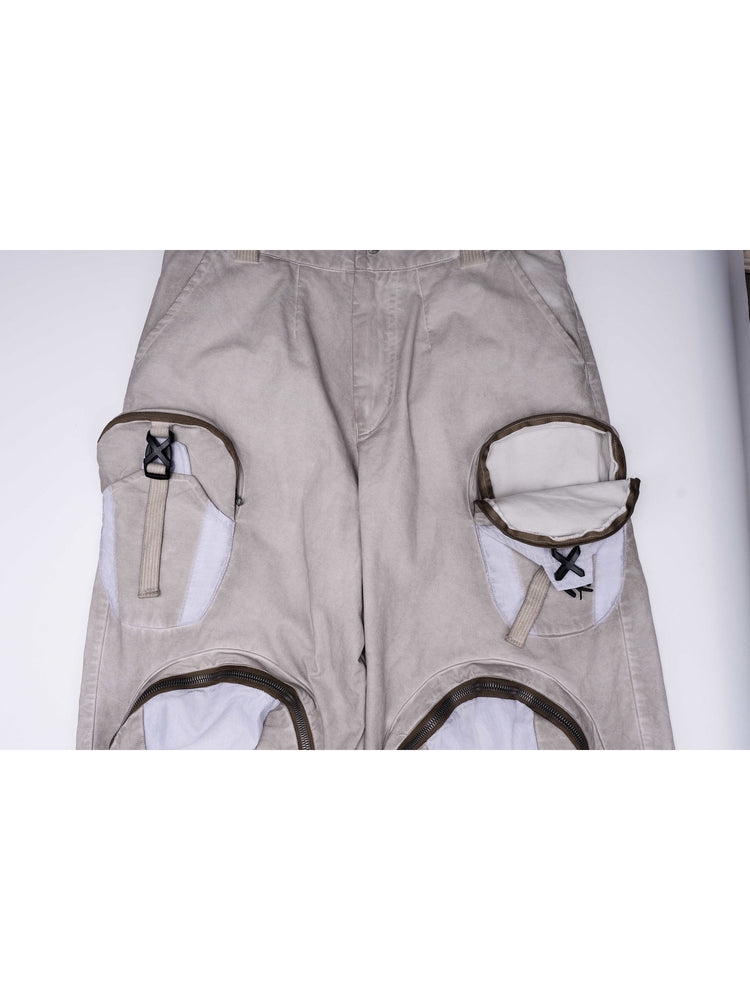PIONEER eris white welded multi-pocket work pants — garment detail with a thigh pouch unzipped to show its interior