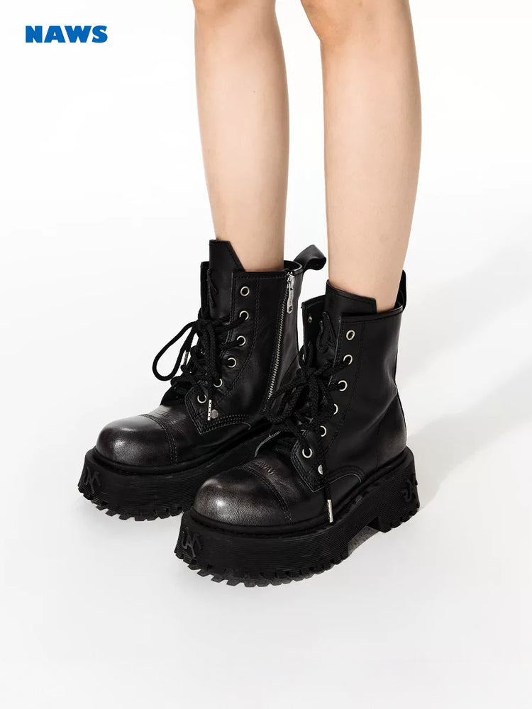 NAWS KNIGHT leather platform lace-up boots in SEA NIGHT BLACK — three-quarter modeled view showing the color-brushed leather and chunky soles.
