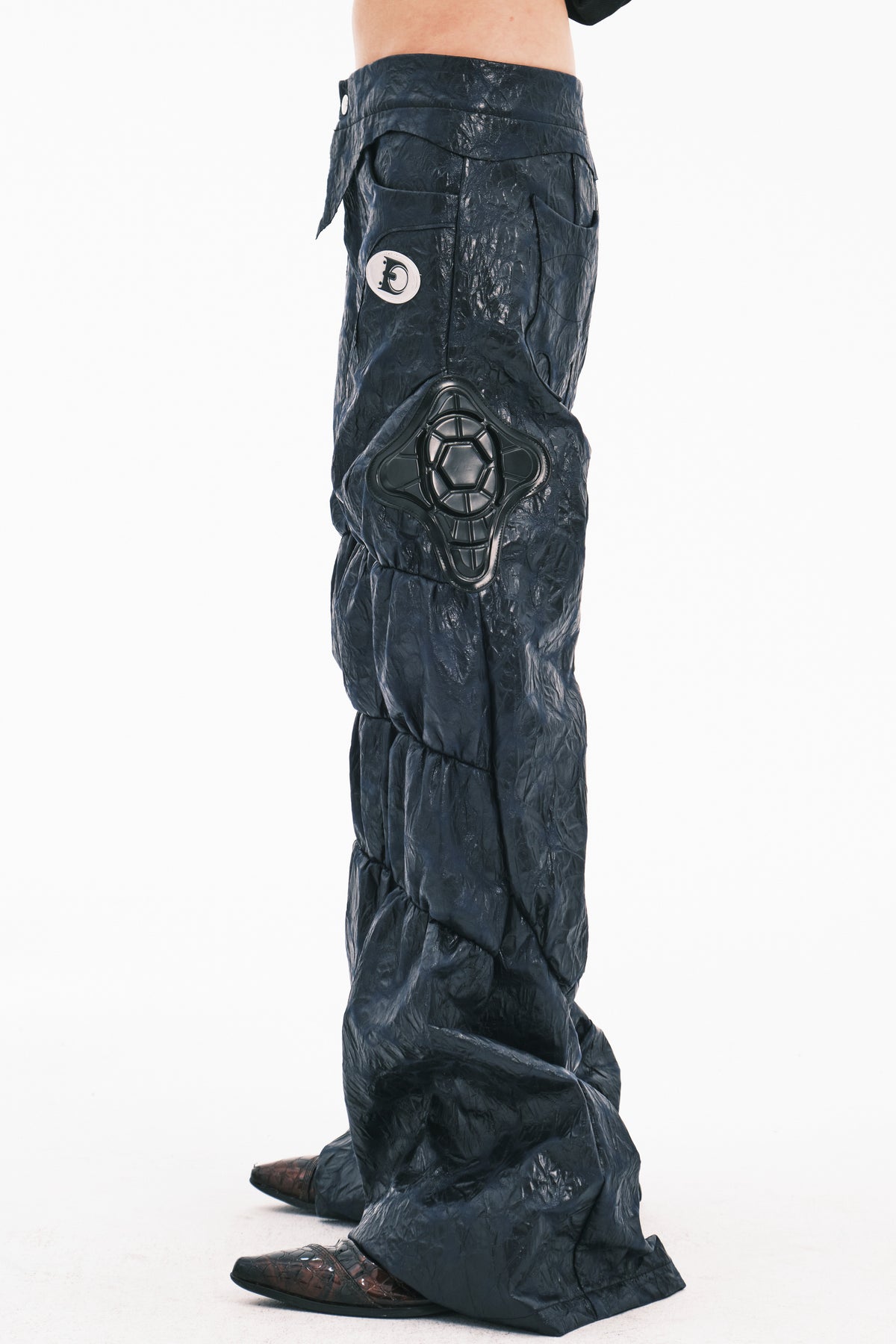 EMBRYO GUARD SHELL ruched PU leather flare pants — full-length modeled styling view