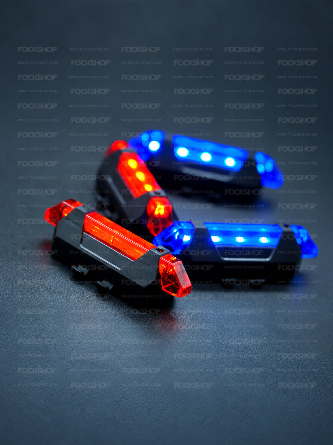 FOCKSHOP TRAIN L rechargeable costume light pair — red and blue light group with one red housing in sharp focus
