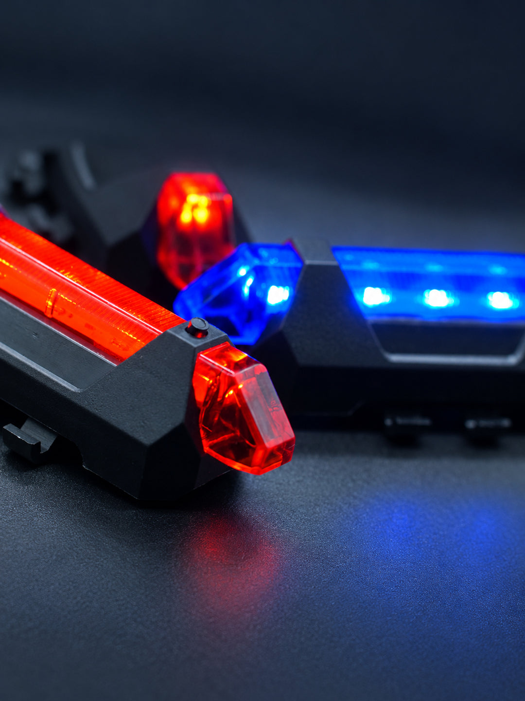 FOCKSHOP TRAIN L rechargeable costume light pair — close-up of the power button and translucent red cover