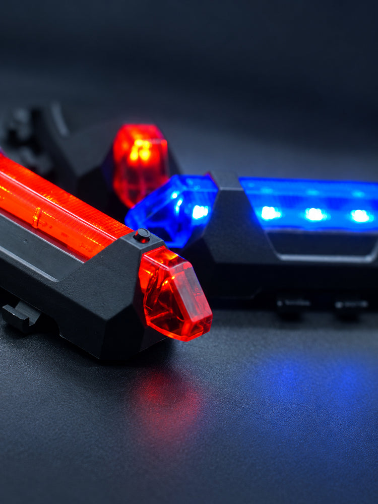 FOCKSHOP TRAIN L rechargeable costume light pair — close-up of the power button and translucent red cover