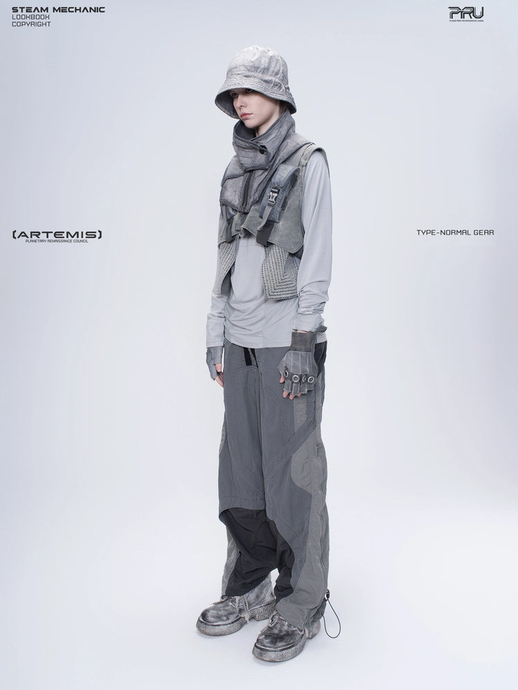 ARTEMIS moon dust gray stretch technical base-layer top — three-quarter full-length styling view with a separate utility vest