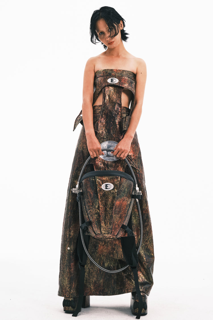 EMBRYO ORACLE embossed backpack — full-length modeled view