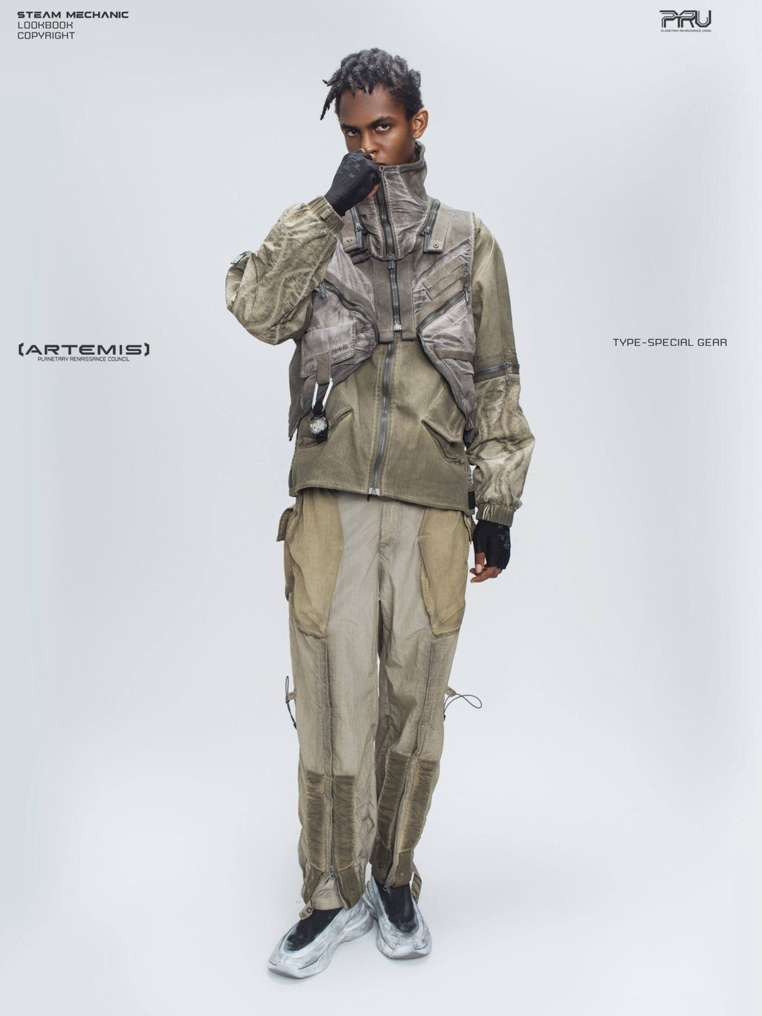 FISSION modular vest — mercury brown full-length modeled view with hand at collar