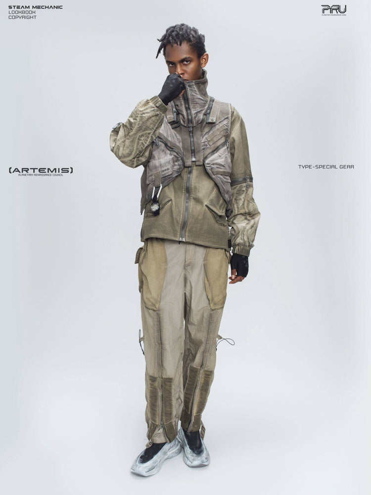 FISSION modular vest — mercury brown full-length modeled view with hand at collar