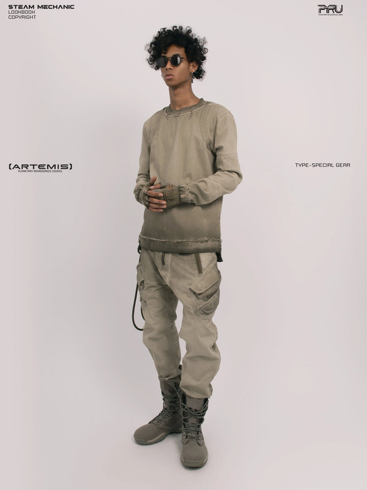 CHAOS ERA xirang brown raw-edge long-sleeve top — full-length front view with hands clasped