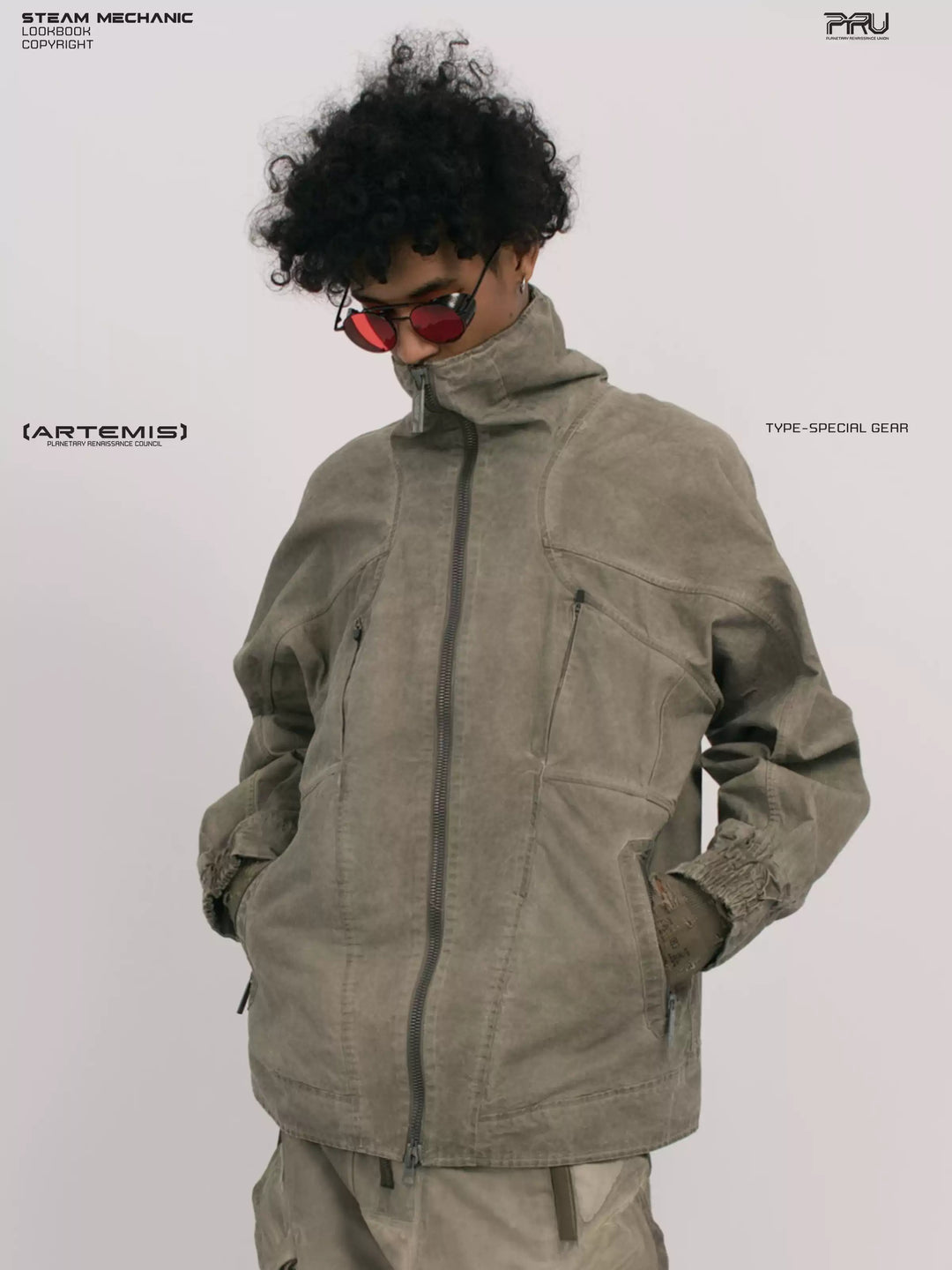 ARTEMIS xirang brown tuck-paneled technical jacket — close modeled front view with the collar zipped and both hands in the pockets
