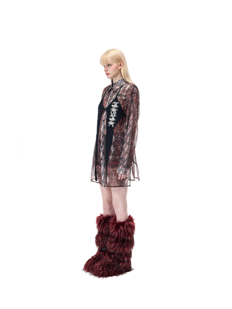 PINKSPINK THORNSTAR open-knit halter top in black — full-length side modeled view layered over a separate snakeskin-print shirt
