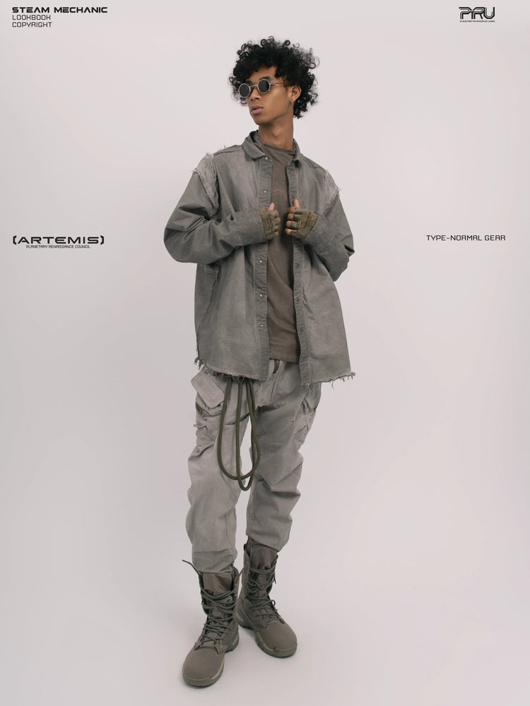 CHAOS ERA moon dust gray raw-edge technical shirt — full-length front modeled view with clasped hands