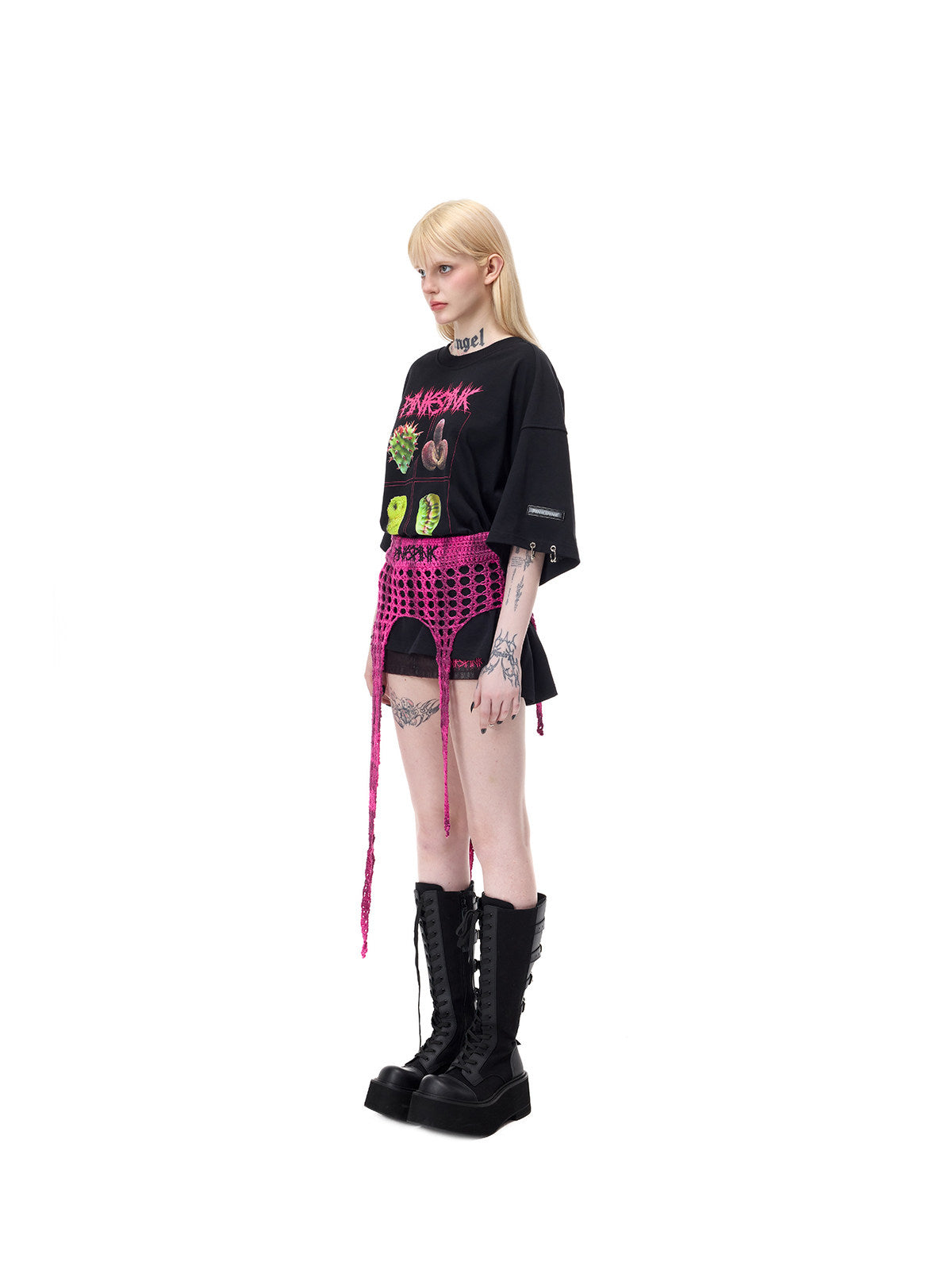 PINKSPINK THORNSTAR open-knit layering skirt in hot pink — full-length side modeled view showing the asymmetric pointed panels