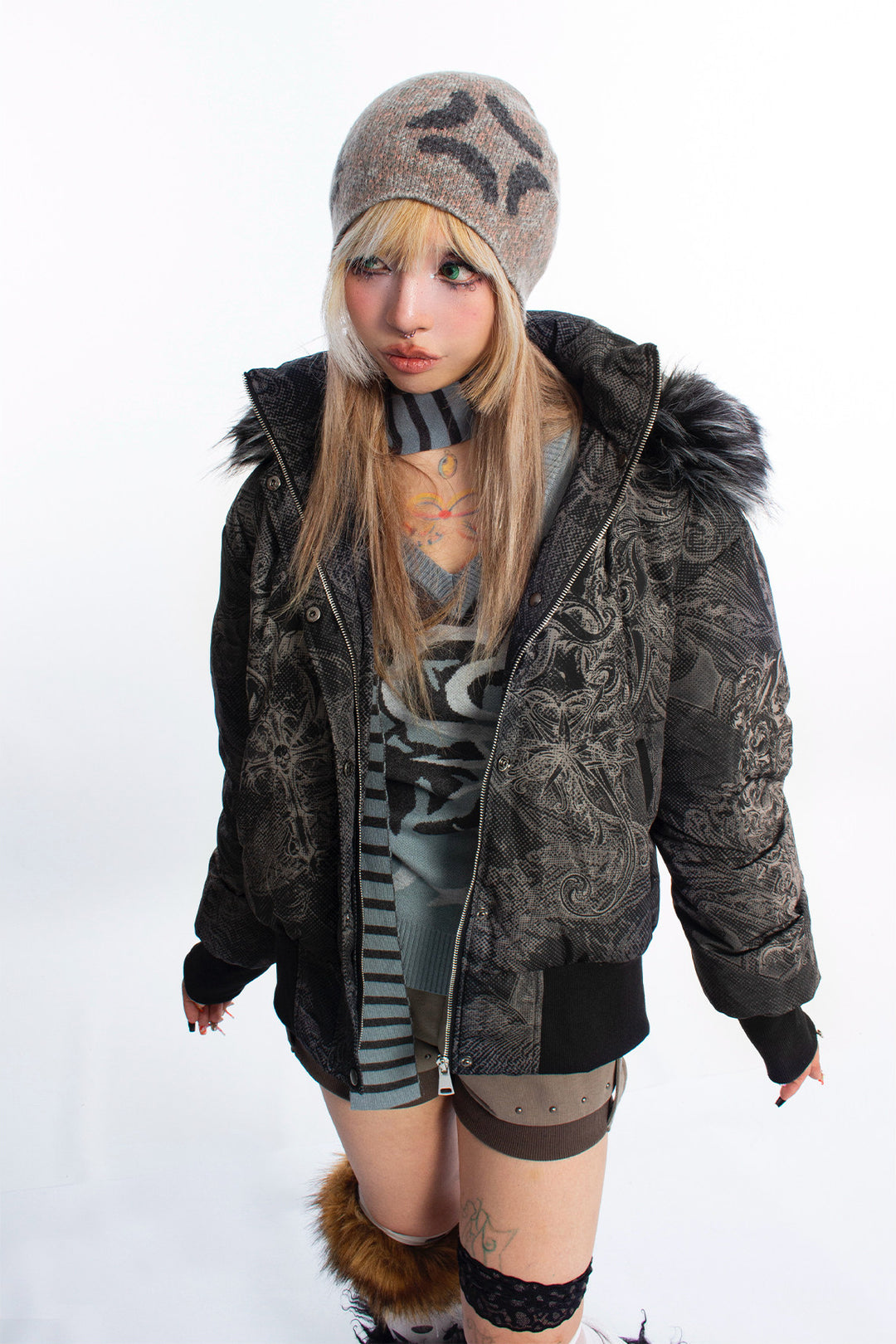 4RE1GN GOTHIC down jacket in charcoal ornamental print — Open-front modeled close-up showing zipper and snap fastening.