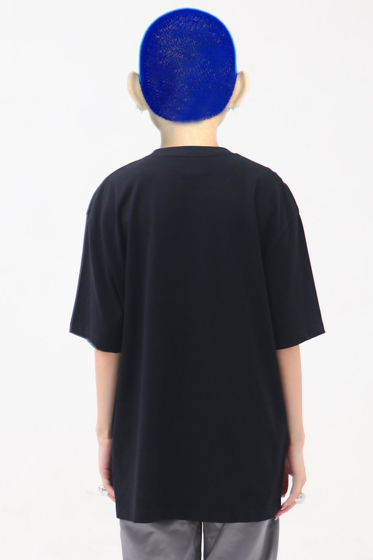 EMBRYO E23 LITTLE ONE oversized black graphic tee in black — straight rear modeled view showing the plain back