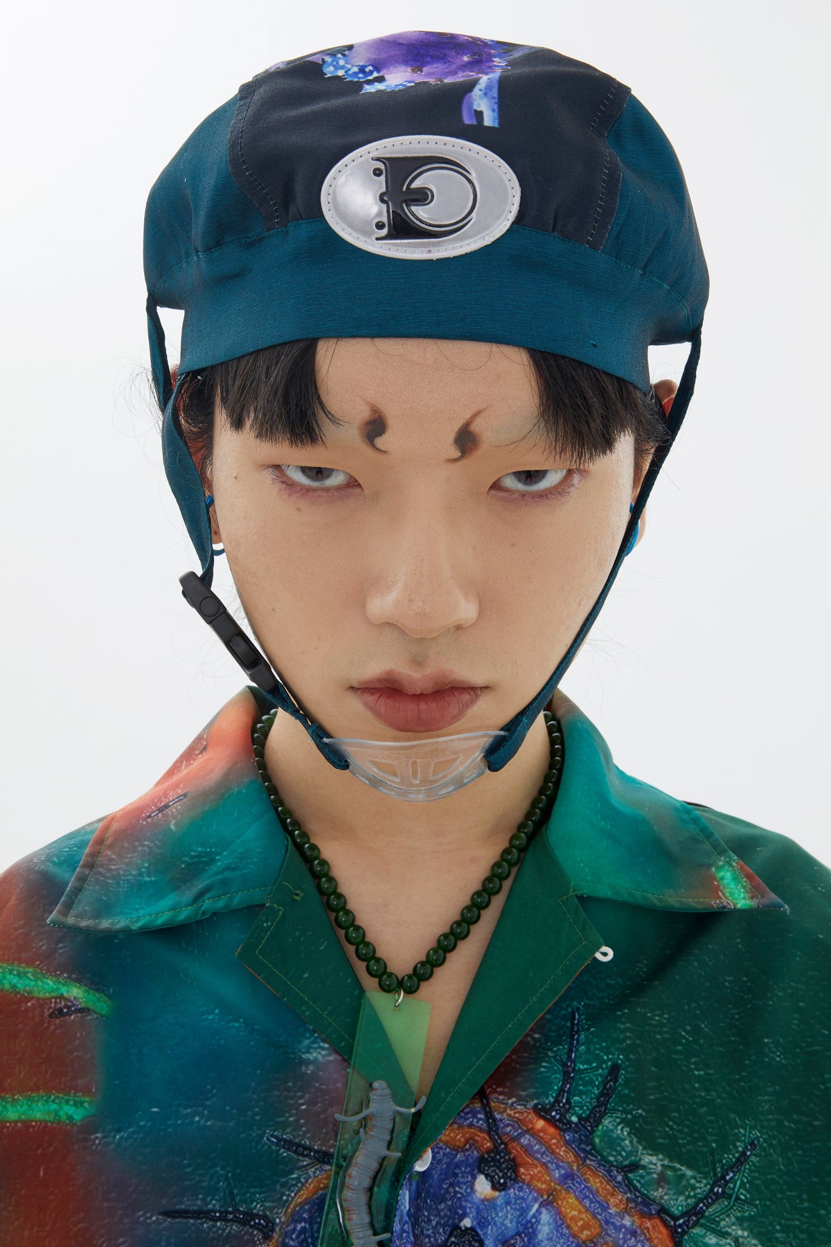 EMBRYO LARVA patchwork cycling cap — material and hardware detail