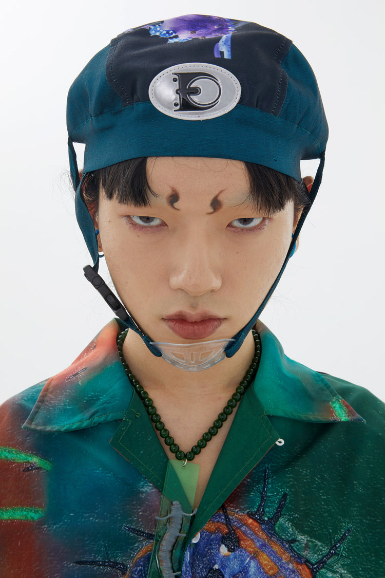 EMBRYO LARVA patchwork cycling cap — material and hardware detail