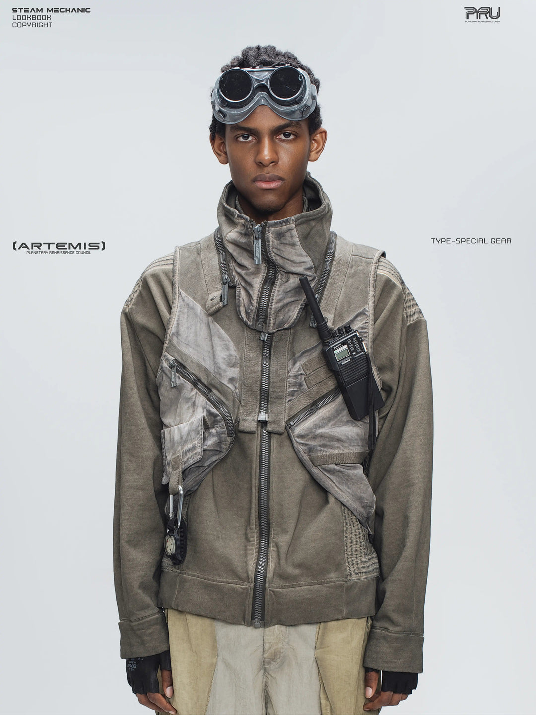 FISSION modular vest in mercury brown — close modeled front view showing the detachable collar and diagonal pockets