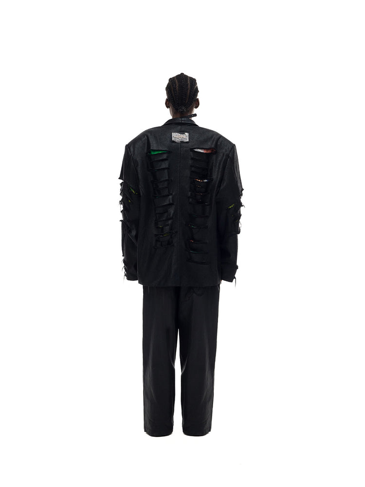 PINKSPINK ELECTRIC MOON coated zip-knee wide-leg pants in black — rear full-length modeled view styled with a blazer